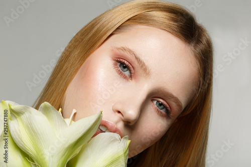 Close up portrait of young female model with perfect skin and beautiful eyes