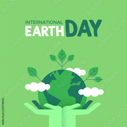 Earth Day card of human hands holding green planet