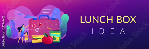 Businesswoman with child pointing to lunch box and sandwich with apple, tiny people. Kids lunch box, lunch box idea, balanced kids nutrition concept. Header or footer banner template with copy space.