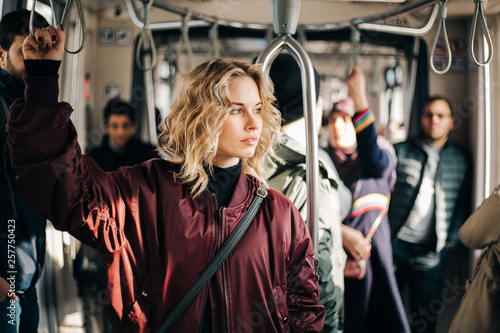 Image of curly blonde riding in bus.