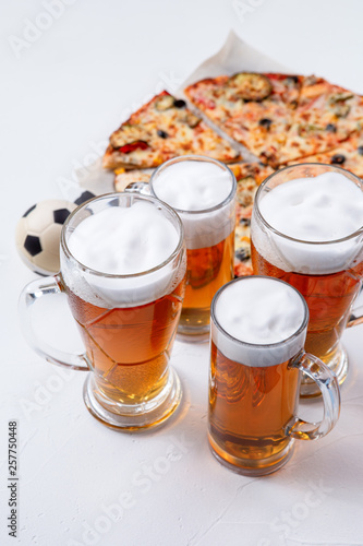 Photo of glasses with foam beer, pizza photo