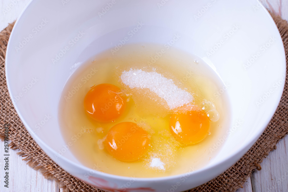 Cooking, egg yellow on white sugar for baking cookies Cooking, egg yellow on white sugar for baking cookies
