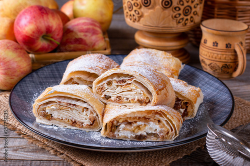Traditional piece of apple strudel with powdered sugar