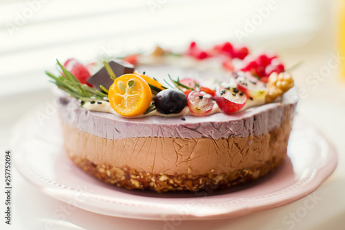 raw vegan cake with fruits and seeds
