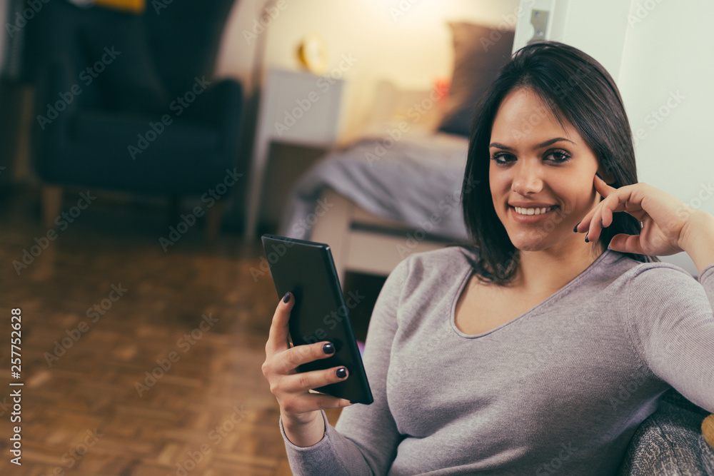 woman using tablet in her
