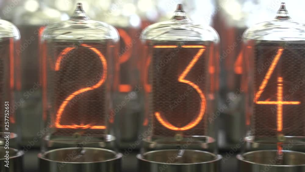 Nixie tube retro electronic clock numbers, cold cathode display, glow discharge Nixie tube retro electronic clock numbers, cold cathode display, glow discharge