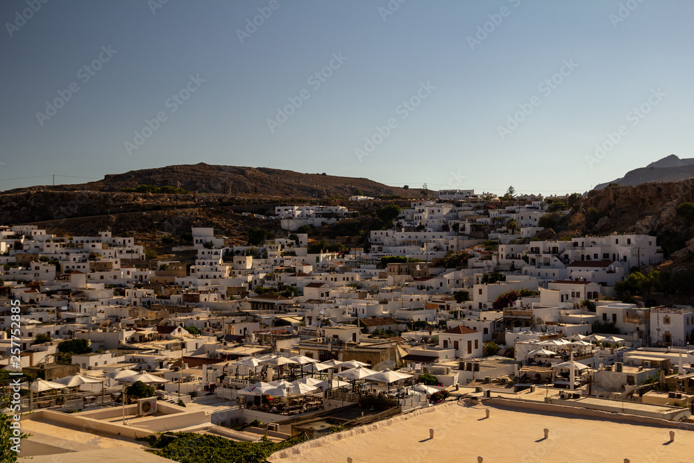 Fototapeta premium View of the modern Lindos from the acropolis. Rhodes Island, Greece.