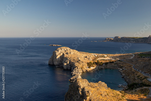 View from the Acropolis of Lindos on the bay of the Apostle Paul at sunset. Rhodes Island, Greece