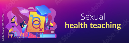 Female teacher at board giving a lesson on sexual education to students. Sex education, sexual health teaching, sex education lesson concept. Header or footer banner template with copy space.
