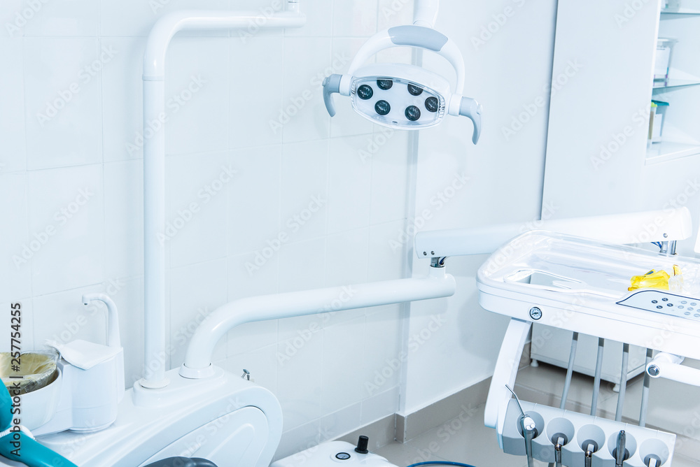 Photo of the bright dentist's office through the door ajar Photo of the bright dentist's office through the door ajar