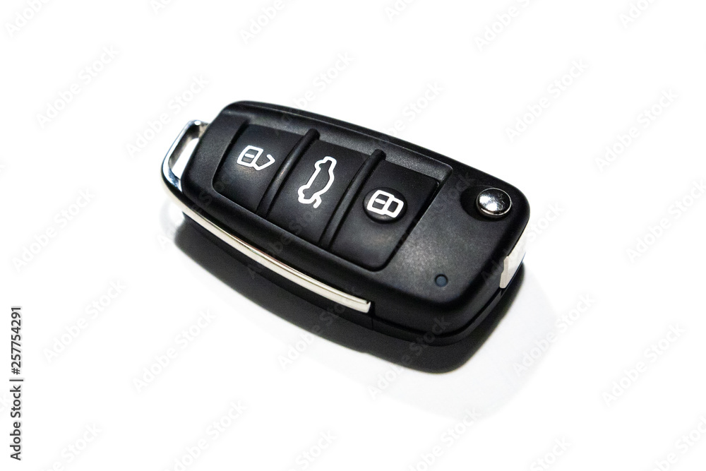 A compact modern car key isolated on a white background A compact modern car key isolated on a white background