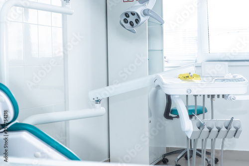 Photo of the bright dentist s office through the door ajar