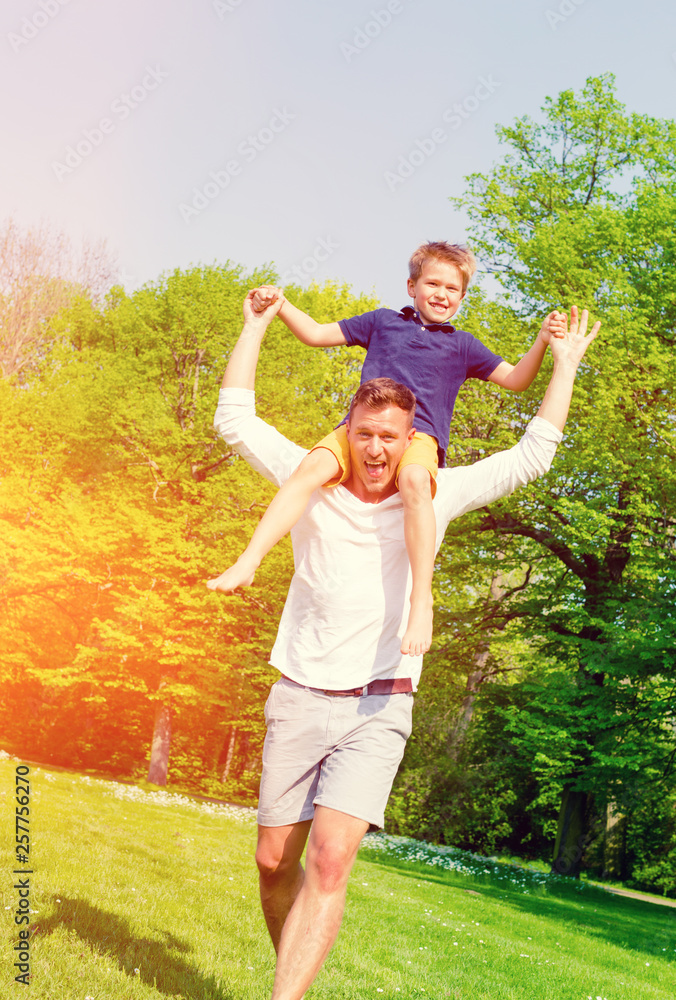 happy father and son piggyback