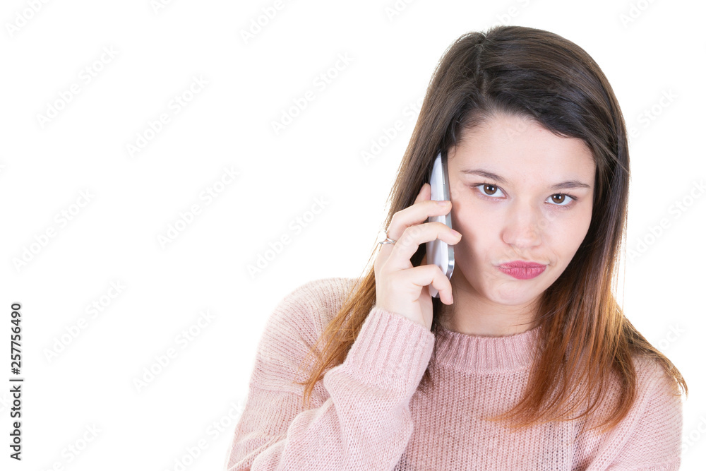 portrait of young woman with mobile phone looking down with copy space portrait of young woman with mobile phone looking down with copy space