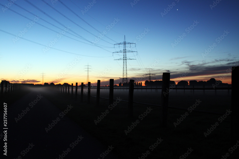 Sunset in countryside electrical tower