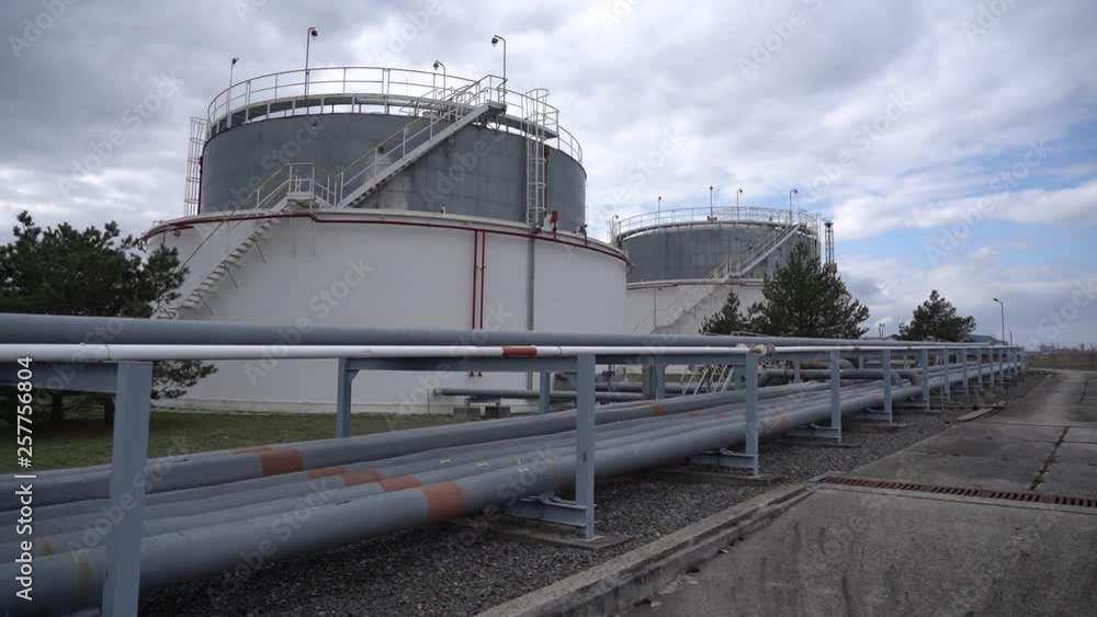 Liquid and fluid gas or oil storage tank, holder, container, dramatic sky background copy space Liquid and fluid gas or oil storage tank, holder, container, dramatic sky background copy space