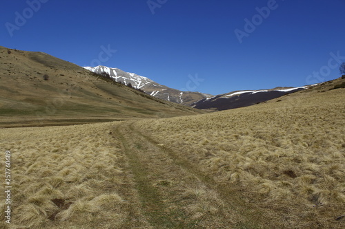 Mountain road in a trekking day, Sibillini Mountains, Castelluccio, Norcia, Umbria, Italia