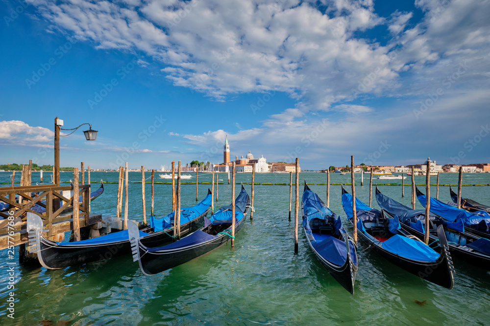 Gondolas and in lagoon of Venice by San Marco square. Venice, Italy