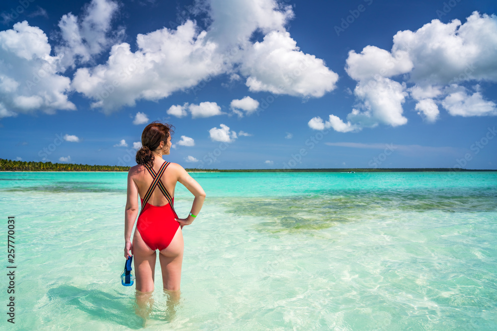 Young woman in bikini and scuba mask standing on the beach in Dominican Republic Young woman in bikini and scuba mask standing on the beach in Dominican Republic