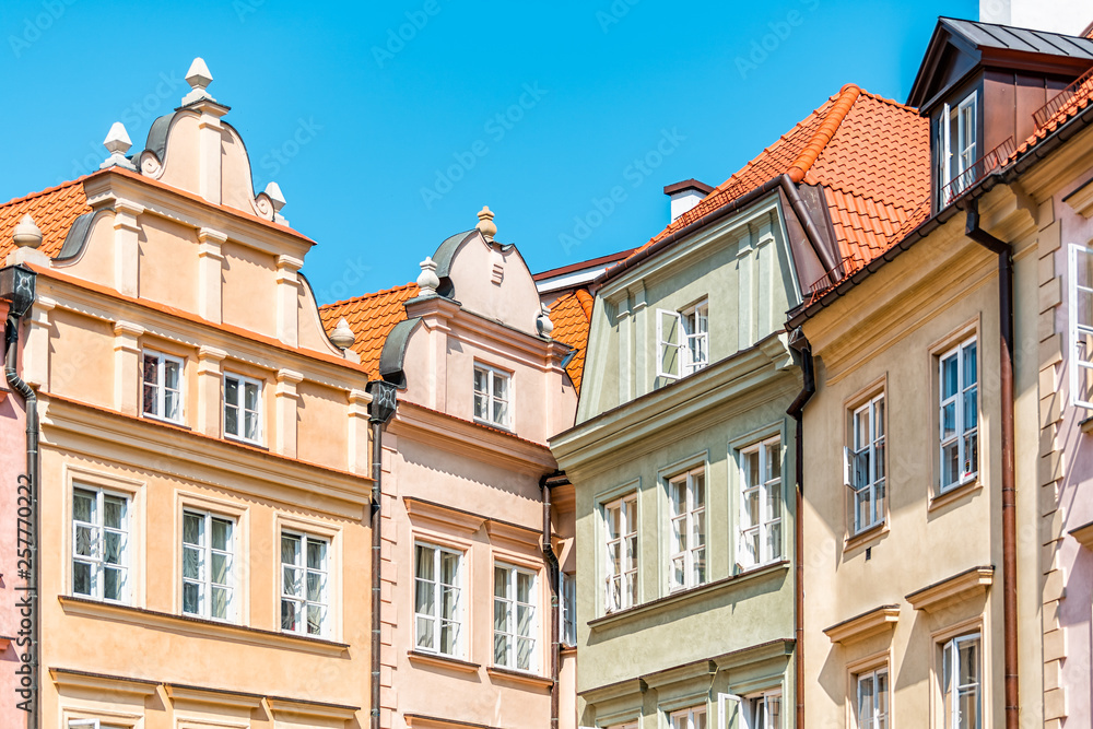 Warsaw, Poland old town square with historic street town architecture and multicolored pattern of pink and yellow vintage color buildings