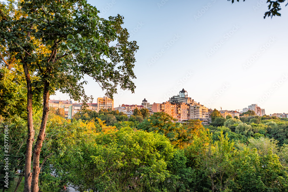 Kyiv, Ukraine Landscape alley in Kiev capital city during sunset golden sunlight with hill peak cityscape skyline
