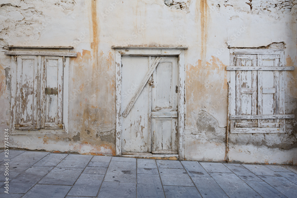 Abandoned building in Ermoupoli town on Syros island in Greece. Abandoned building in Ermoupoli town on Syros island in Greece.