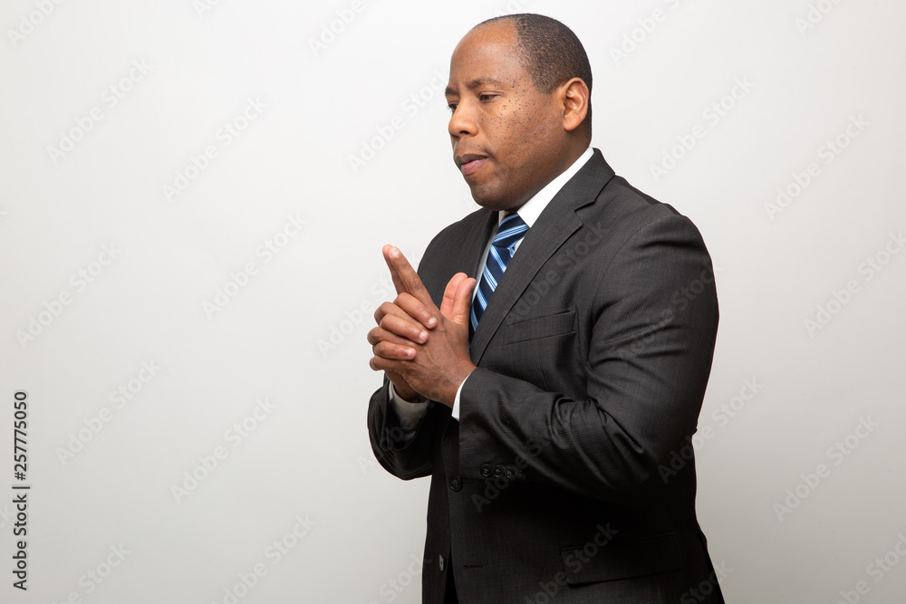 African Business Man Dressed in Suit Thinking African Business Man Dressed in Suit Thinking