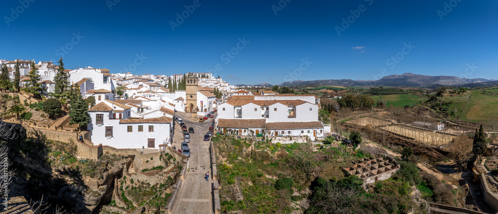 Ronda Spain medieval hilltop town surrounded by walls and towers with famous bridge over gorge