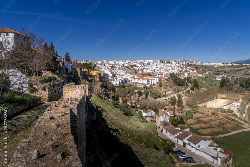 Ronda Spain medieval hilltop town surrounded by walls and towers with famous bridge over gorge