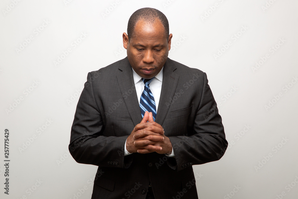 African Business Man Dressed in Suit Thinking On Light Gray Background African Business Man Dressed in Suit Thinking On Light Gray Background