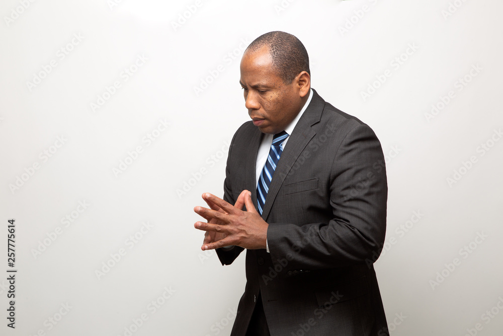African Business Man Dressed in Suit Thinking