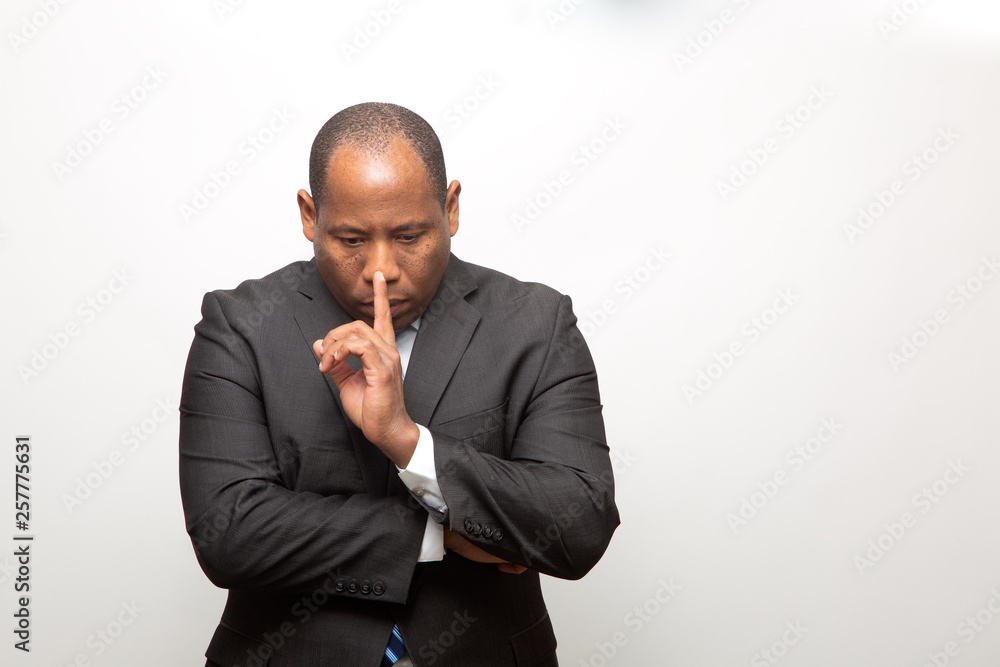 African Business Man Dressed in Suit Deeply Thinking African Business Man Dressed in Suit Deeply Thinking