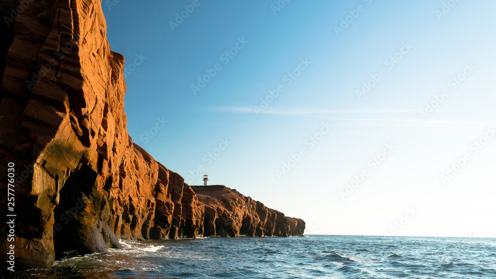 Lighthouse Behind Red Cliffs