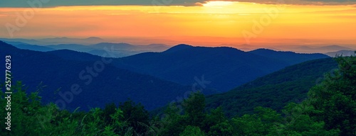 Setting sun over mountain range is Shenandoah national park 