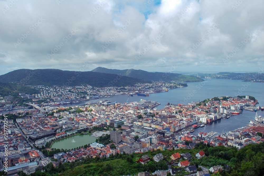 View of Bergen Norway from top of the hill, overlooking city buildings, landmarks, and harbor. 