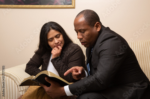 Fototapeta Naklejka Na Ścianę i Meble -  Mixed Raced Christian Couple Studying Bible Together