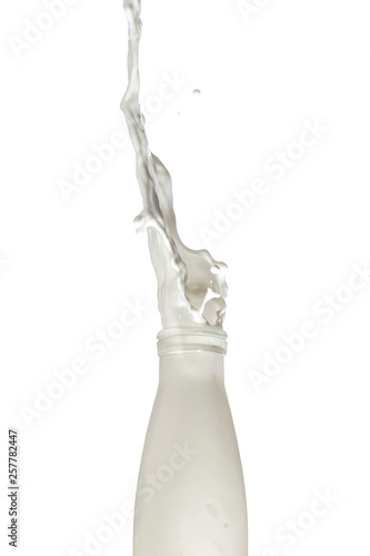 Droplets of Milk With Liquid Splashes Out Of The Bottle. Isolated Over White Background.
