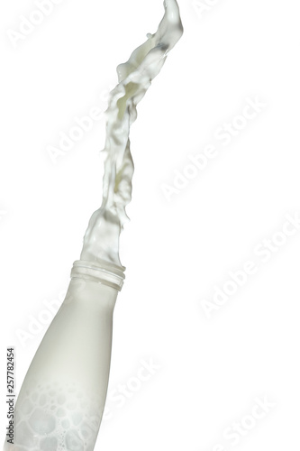 Liquids Photography. Milk Stream Pouring Out Of The Bottle. Isolated Over White Background.