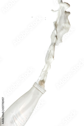 Fast Action Liquids Photography. Milk Droplets and Splashes Pouring Out Of The Bottle. Isolated Over White Background.