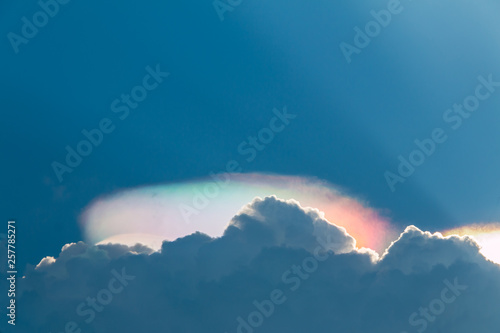 Beautiful iridessent pileus cloud in the sky