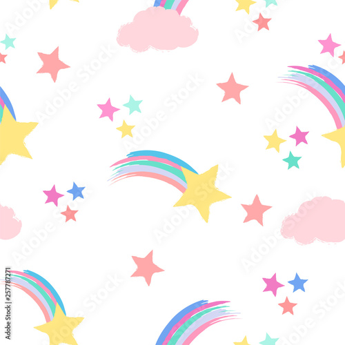 Seamless repeat pattern in pastel colors with shooting stars, rainbows and clouds