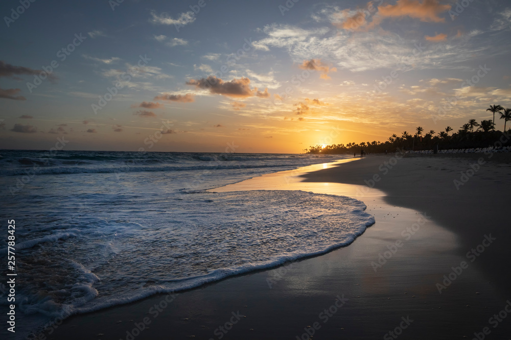 Sunrise over a beach with waves in the Dominican Republic