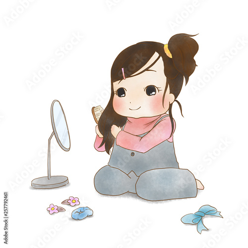 自分で髪を結う女の子