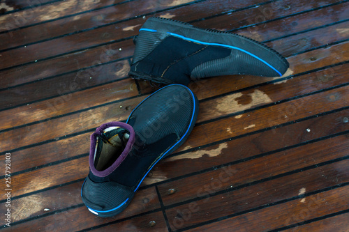 Special shoes for diving on a wooden background photo