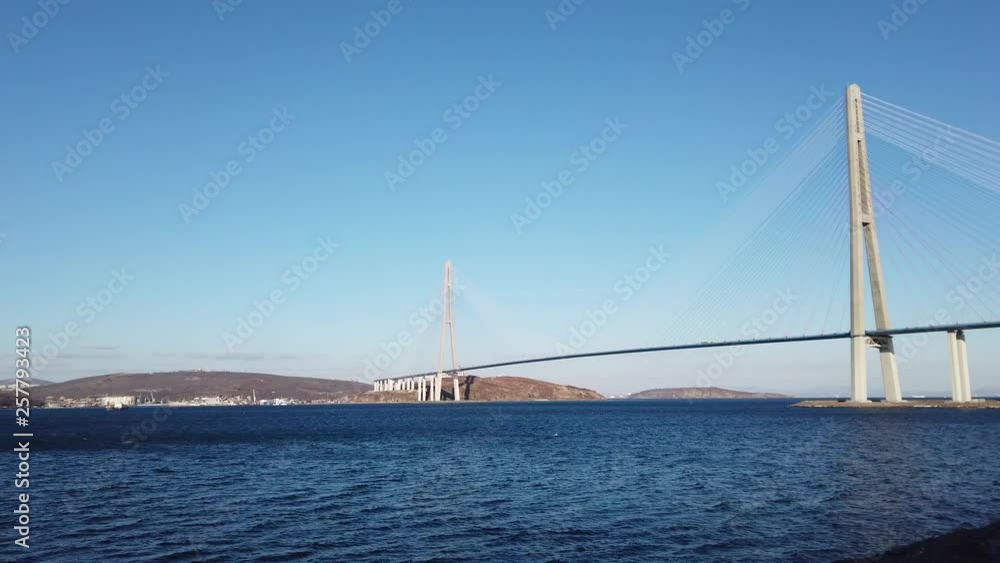 Vladivostok, Primorsky Krai-March 23, 2019: Marine landscape with views of the Russian bridge on the horizon. Vladivostok, Primorsky Krai. Vladivostok, Primorsky Krai-March 23, 2019: Marine landscape with views of the Russian bridge on the horizon. Vladivostok, Primorsky Krai.