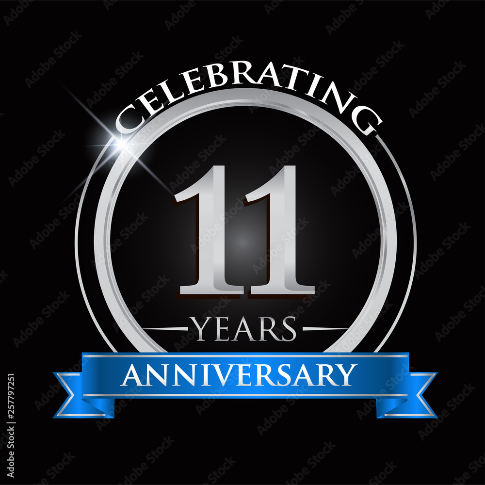 Celebrating 11 years anniversary logo. with silver ring and blue ribbon.