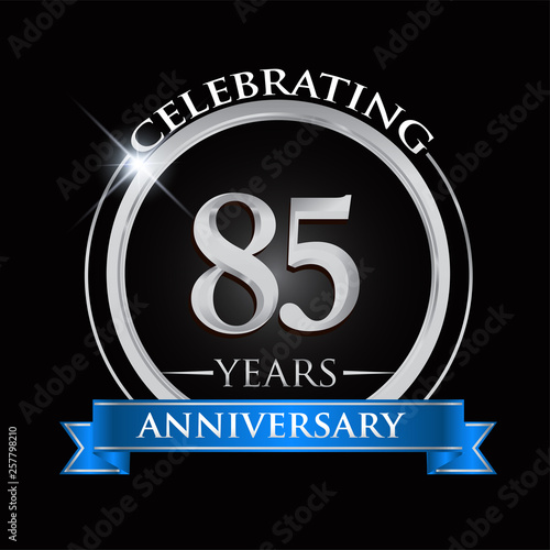 Celebrating 85 years anniversary logo. with silver ring and blue ribbon.