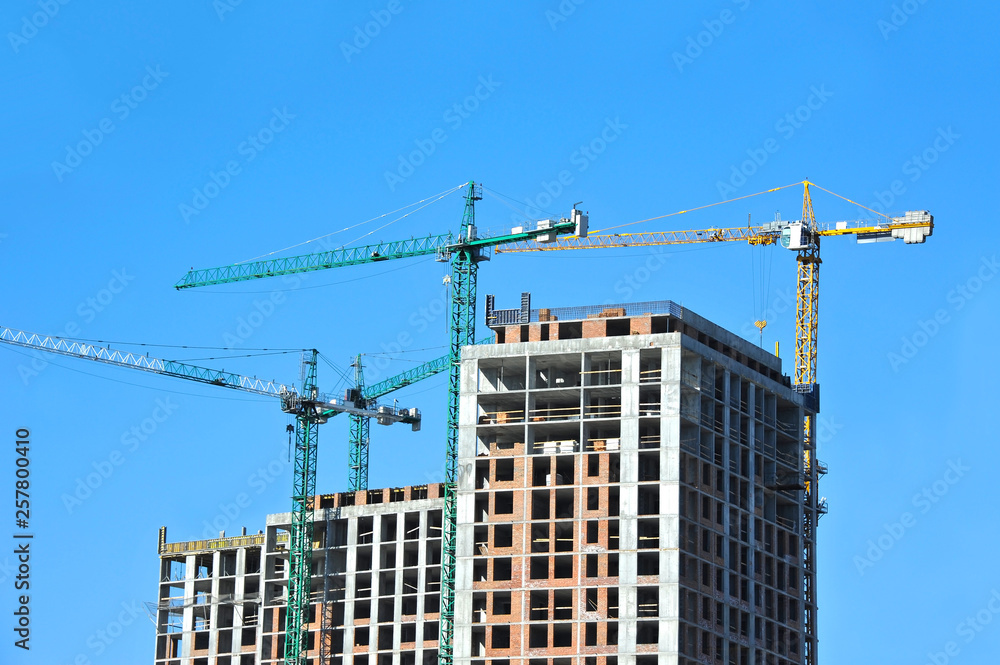 Crane and highrise construction site Crane and highrise construction site