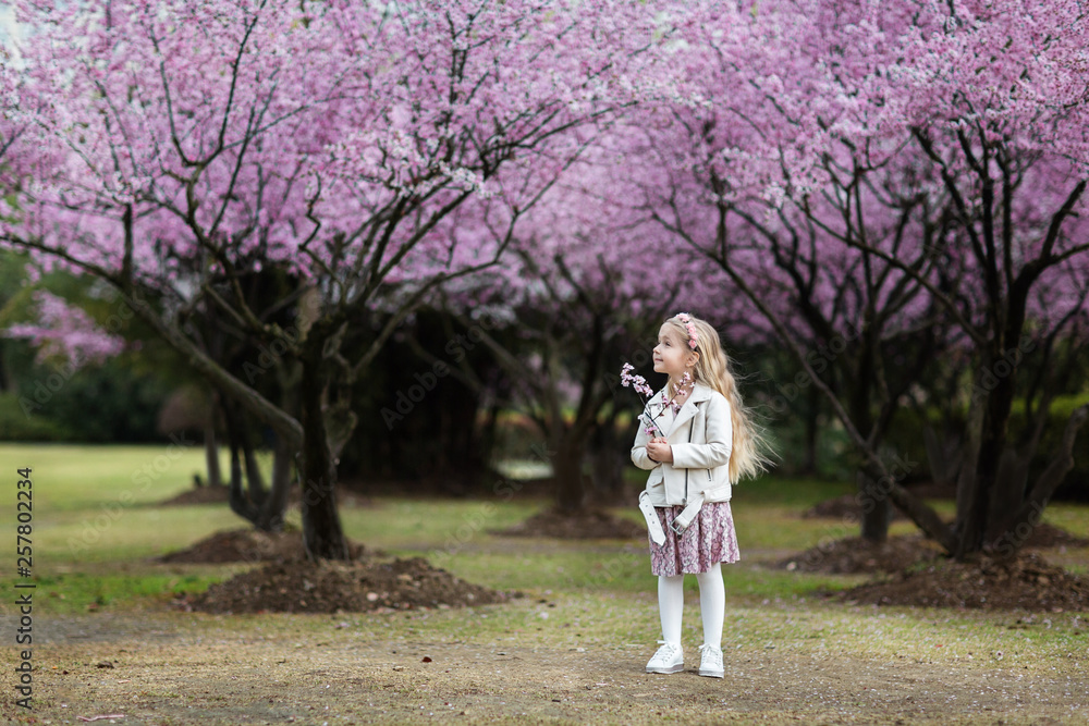 Portrait of cute little girl with blonde hair outdoor. Spring season. Portrait of cute little girl with blonde hair outdoor. Spring season.
