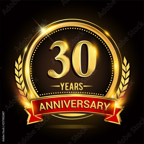 Celebrating 30th years anniversary logo with golden ring and red ribbon.